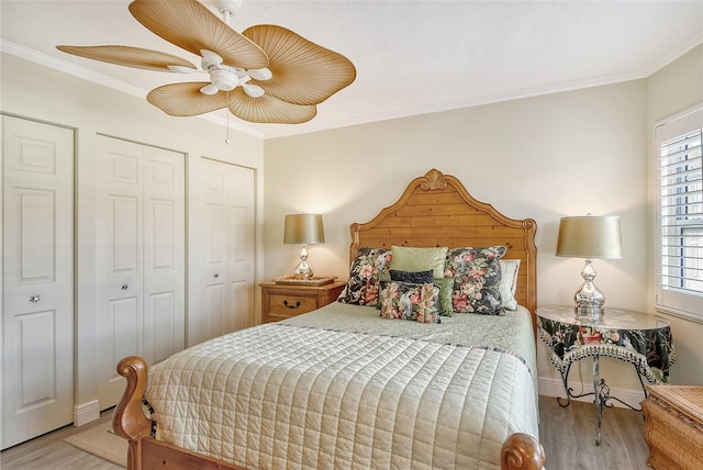 bedroom with ceiling fan, light hardwood / wood-style floors, and ornamental molding