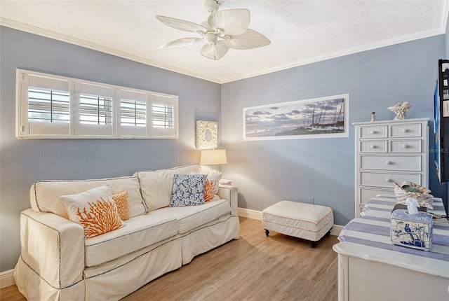 living room with crown molding, a healthy amount of sunlight, wood-type flooring, and ceiling fan