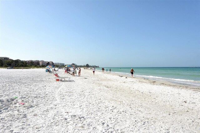 property view of water featuring a beach view