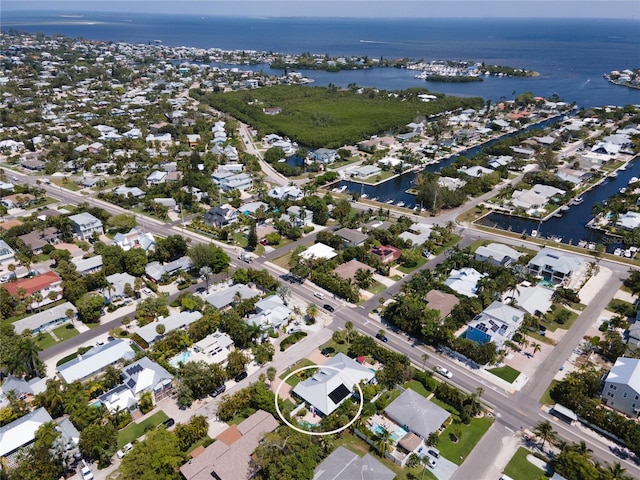 drone / aerial view featuring a water view and a residential view