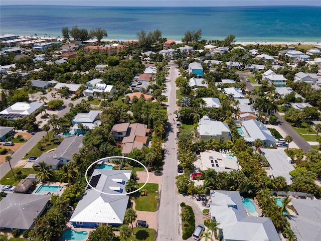 bird's eye view featuring a residential view and a water view