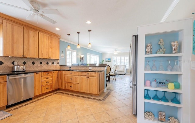 kitchen with hanging light fixtures, stainless steel appliances, kitchen peninsula, decorative backsplash, and light tile patterned floors