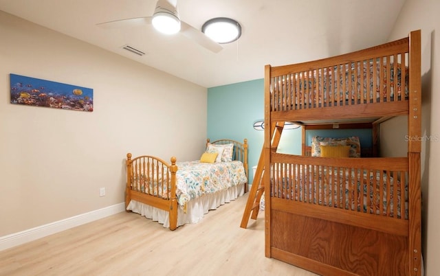 bedroom featuring hardwood / wood-style flooring and ceiling fan