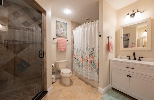 bathroom with vanity, curtained shower, toilet, and a textured ceiling