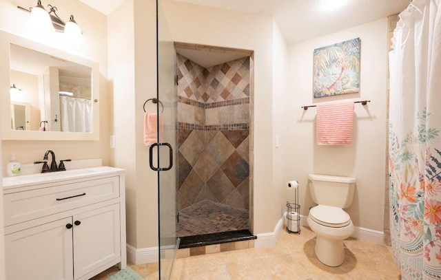 bathroom featuring toilet, a shower stall, vanity, and tile patterned floors