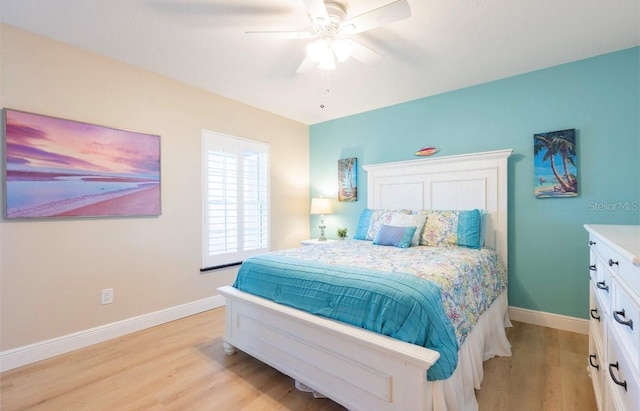 bedroom featuring light hardwood / wood-style flooring and ceiling fan