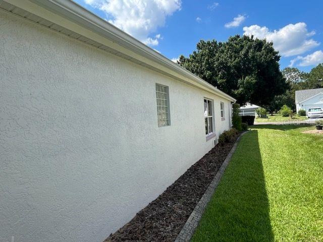 view of home's exterior with a lawn