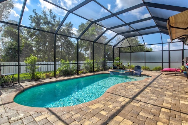 view of pool with a patio, an in ground hot tub, and a lanai