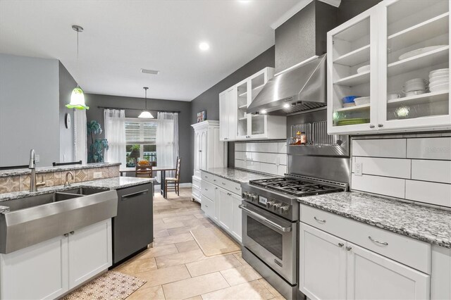 kitchen featuring decorative light fixtures, stainless steel range, glass insert cabinets, white cabinetry, and dishwashing machine