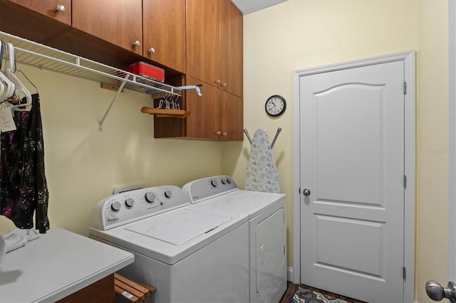 laundry area featuring cabinet space and washing machine and dryer