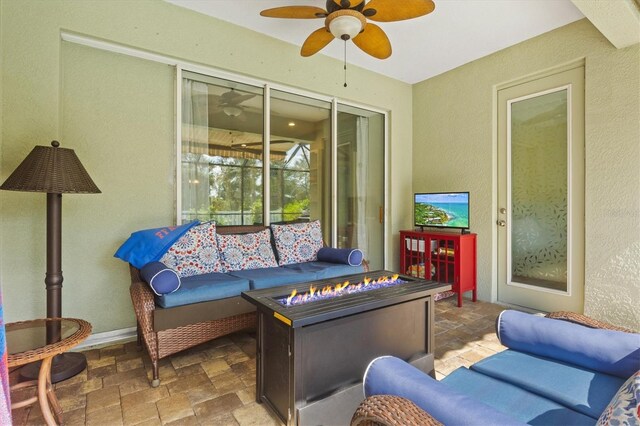 tiled living room featuring ceiling fan