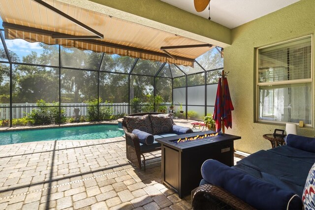 view of patio featuring ceiling fan, an outdoor living space, a fenced in pool, and a lanai