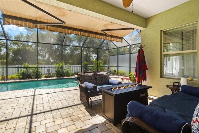 view of patio with a fenced in pool, glass enclosure, an outdoor living space with a fire pit, and a fenced backyard