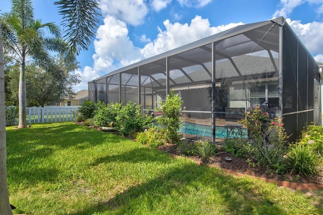 view of yard with a fenced in pool, a lanai, and a fenced backyard