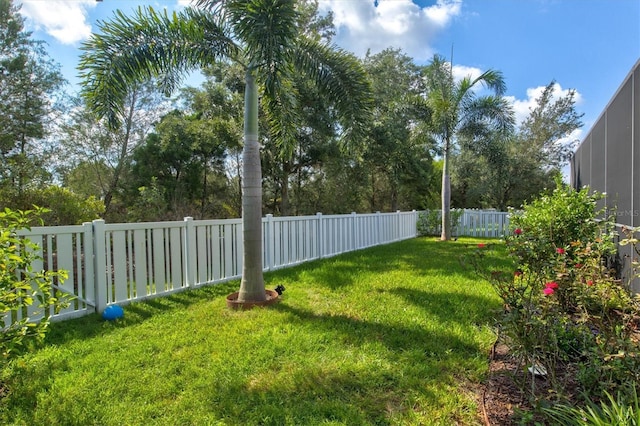 view of yard with a fenced backyard