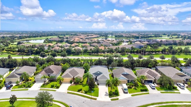 bird's eye view featuring a water view and a residential view