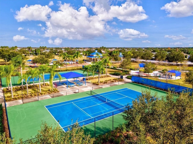 view of tennis court with fence