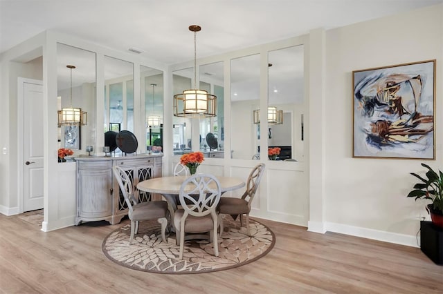 dining space featuring light hardwood / wood-style floors