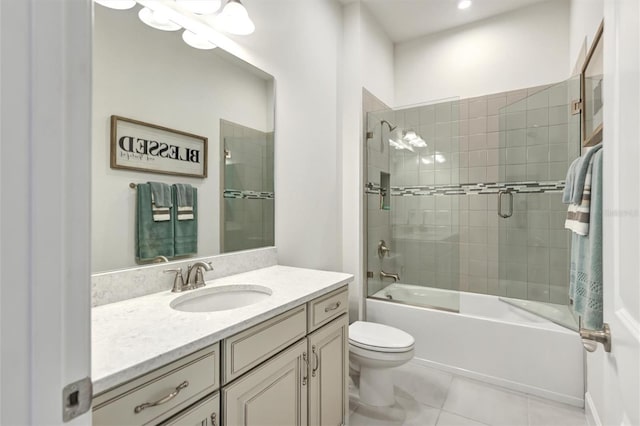 full bathroom with vanity, tile patterned flooring, shower / bath combination with glass door, and toilet