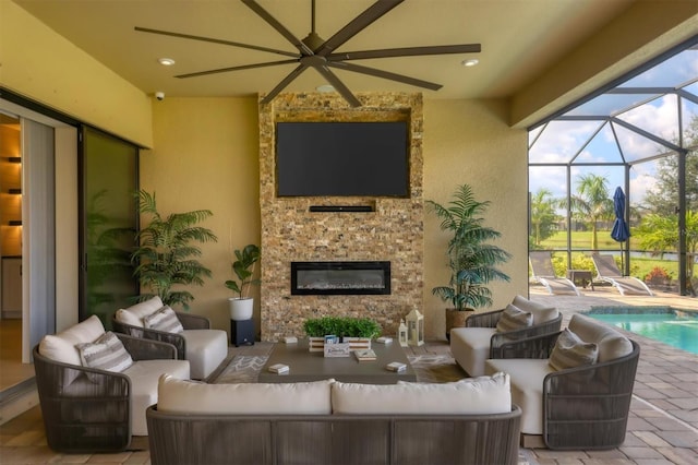 exterior space featuring an outdoor living space, ceiling fan, and a lanai