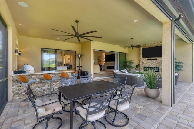 view of patio / terrace featuring area for grilling and ceiling fan