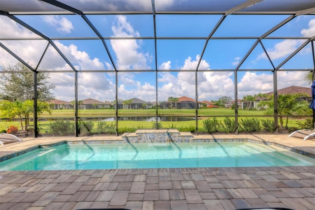 view of pool with a water view, a lanai, and a patio area