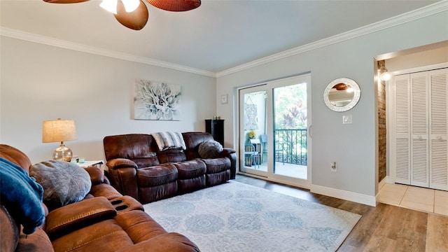 living room with crown molding, hardwood / wood-style floors, and ceiling fan