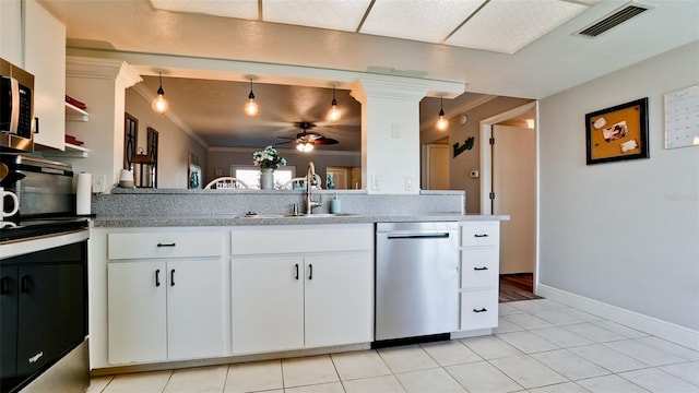 kitchen with ceiling fan, white cabinets, stainless steel dishwasher, and light tile patterned floors