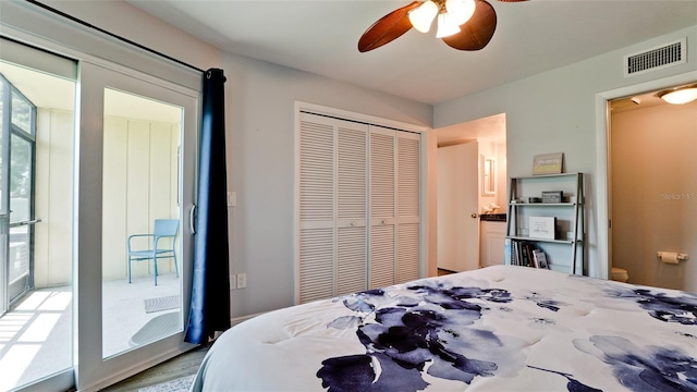 bedroom with ceiling fan, multiple windows, hardwood / wood-style floors, and a closet