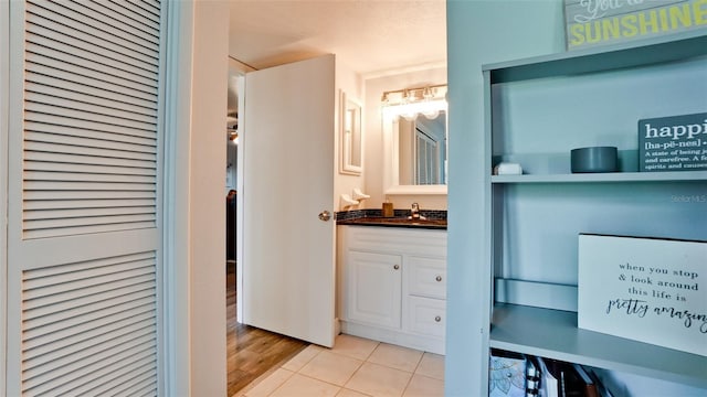 bathroom with vanity and hardwood / wood-style flooring