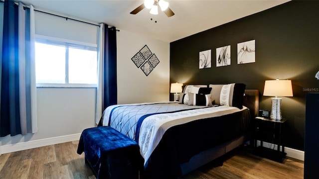 bedroom featuring hardwood / wood-style floors and ceiling fan