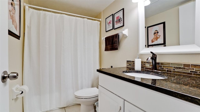 bathroom featuring decorative backsplash, toilet, tile patterned floors, and vanity