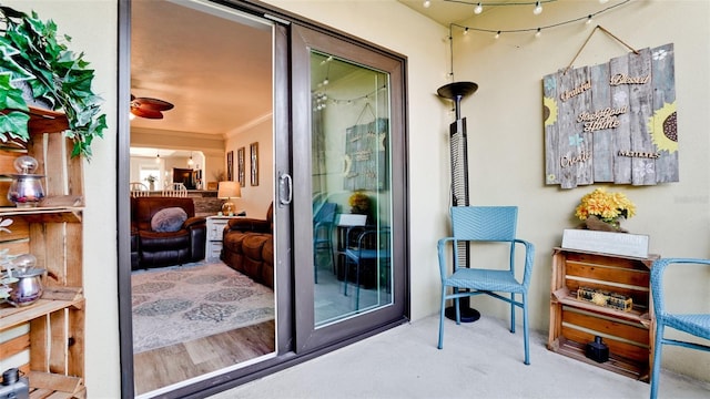 exterior space with crown molding and carpet floors