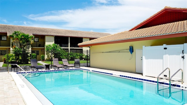 view of pool featuring a patio area