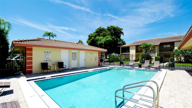 view of swimming pool with a patio