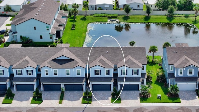 birds eye view of property featuring a water view