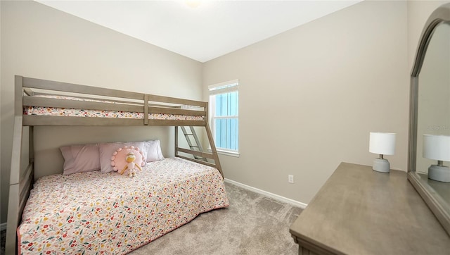 bedroom featuring light colored carpet