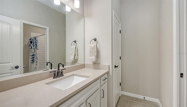 bathroom with a shower with curtain and vanity