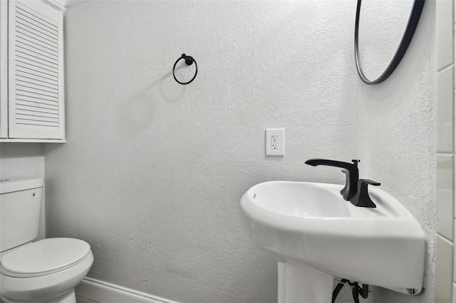 bathroom with sink and toilet