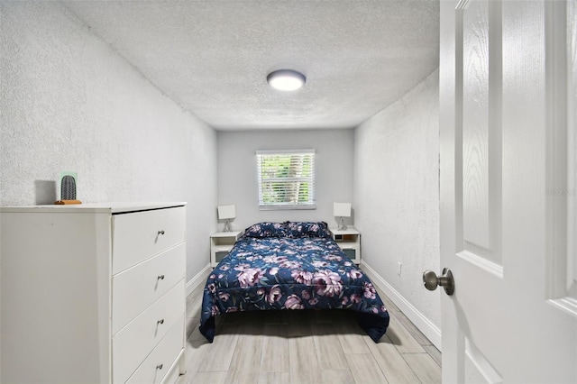 bedroom featuring a textured ceiling