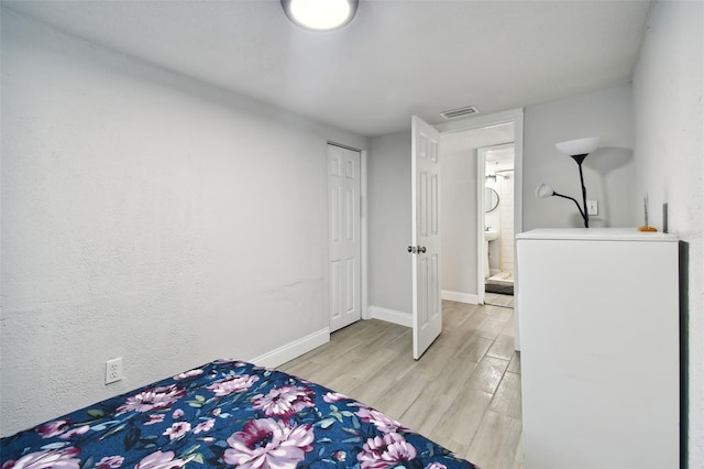 bedroom featuring light hardwood / wood-style flooring