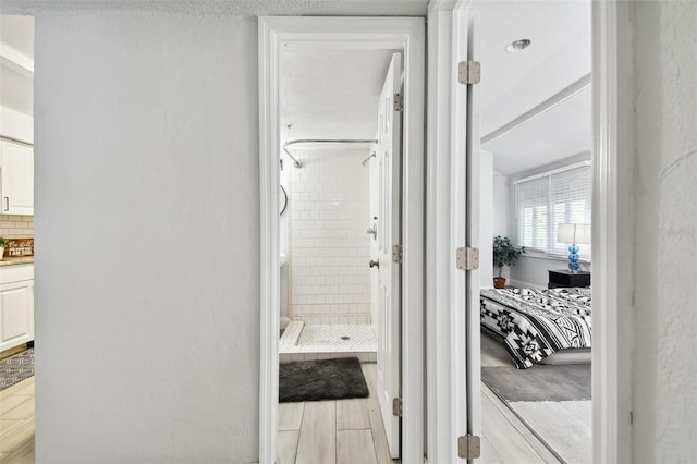 hall with light tile patterned flooring