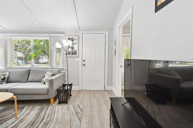 living room featuring light wood-type flooring and vaulted ceiling