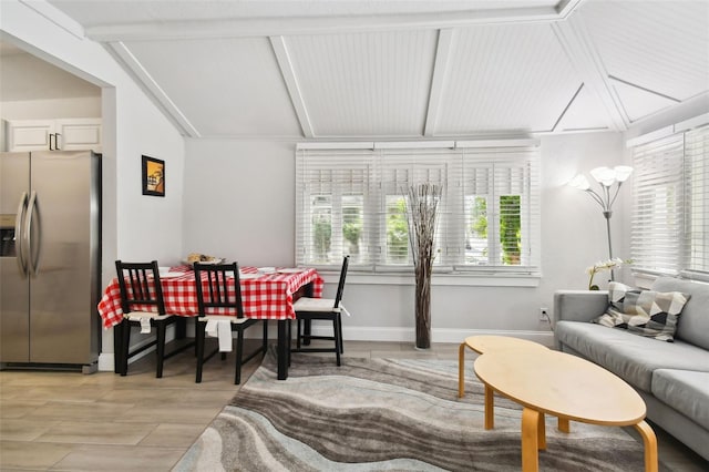 living room featuring light hardwood / wood-style flooring and vaulted ceiling