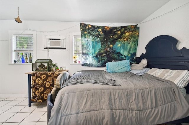 bedroom featuring cooling unit, light tile patterned floors, lofted ceiling, and multiple windows