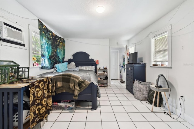 tiled bedroom with multiple windows