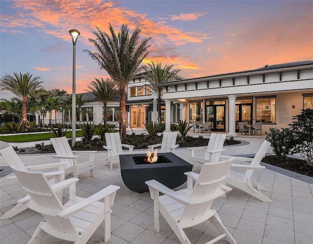 patio terrace at dusk with a fire pit