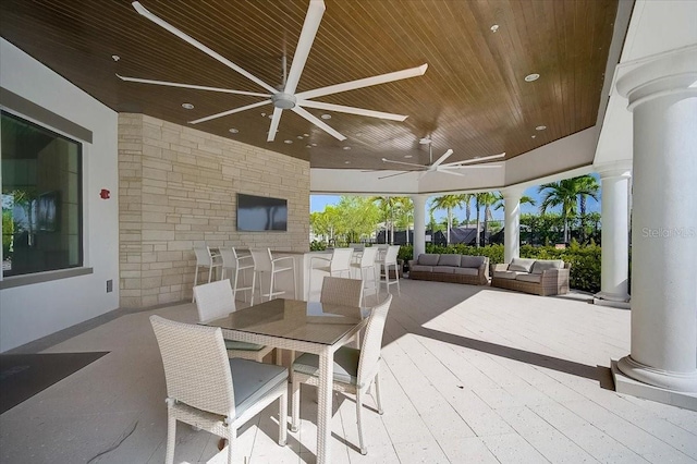 view of patio with ceiling fan and an outdoor living space