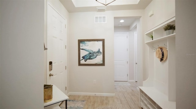 mudroom with light hardwood / wood-style floors