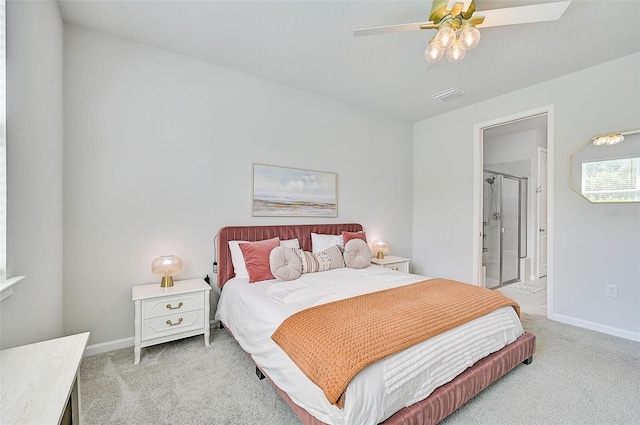 bedroom featuring carpet, ensuite bath, and ceiling fan